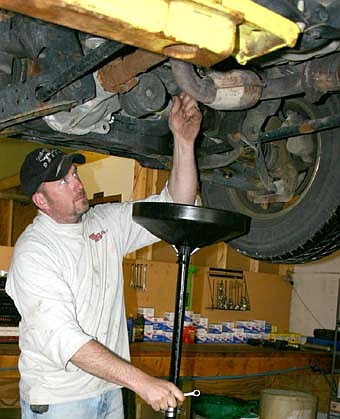 CHANGING THE OIL -- Don Schaefer offers oil changes and a wide variety of other services at Schaefer Automotive, which officially opened for business on  Wednesday, April 16. 