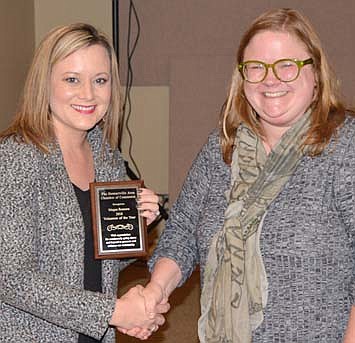 Megan Romans, left, accepts the 2018 Chamber Volunteer of the Year Award from Gwen Ravenhorst.
