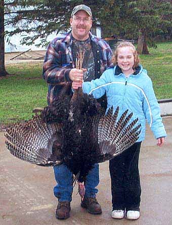 First time turkey hunter, Katie Finley of rural Stewartville bagged this 22.8 lb., 8" bearded turkey on Thursday, April 24.  The bird was shot west of Stewartville in Finley's "secret hunting spot".  Pictured with Katie is her Dad Chet.  