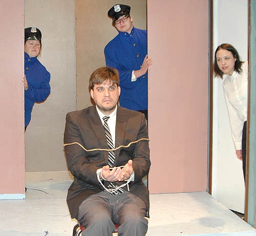 THERE HE IS! -- Klein (Jaymi Wilson), left, Brophy, (Cooper Reed), standing center, and Rooney (Grace Robertson), right, finally locate Mort (Ryan Frank), seated, during a dress rehearsal for the Stewartville Community Theatre production of Arsenic and Old Lace.