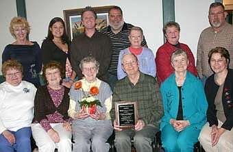 AWARD WINNERS -- George and Florence Reinhart, seated in center,  have been named the recipients of the Stewartville Community Services Advisory Council's Community Service Award for 2008. Seated with the Reinharts are members of the Community Services Advisory Council,  including, from left, Pat Leonard, Mary Hustak, Millie Petersen (second from right) and Shirley Carlson.  Back row, from left, are Marjorie Brunson, the Reinharts' daughter; granddaughter Katie Reinhart, grandson John Hanson and son Dave Reinhart, along with Community Services Advisory Council Board members Nancy Momeny, Iz Wilken and Gary Buns. 