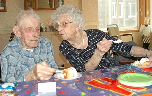 Myrtle Tebay, right, appears ready to tell Orven Blegen a secret as the two celebrated their 102nd birthdays with a party at the Stewartville Care Center on Tebay's birthday on Wednesday, March 27. Blegen turned 102 two days later, on Friday, March 29. Two years ago, the two attended a party at the Stewartville Civic Center to celebrate their 100th birthdays. At that celebration, Tebay spoke of the keys to a long life, saying she never drank and never smoked. "Those are two things," she said at the time. "And Ray (her husband) and I exercised a lot. We did a lot of walking." Blegen also spoke about living past 100, saying he was very grateful. "I can't hardly believe it," he said. "I feel pretty good, so I should be thankful."