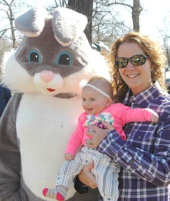 Hundreds of children and their parents attended the annual Sons of the American Legion Easter Egg Hunt at Florence Park in Stewartville on a beautiful spring morning on Saturday, April 20. At left, Kris Swanton holds her granddaughter, Harper Grant of Stewartville, 4 months old, during a meeting with the Easter Bunny before the hunt began. Children turned in their eggs for tickets used in a drawing for prizes, which included bicycles, scooters, basketballs, soccer balls, baskets and more.