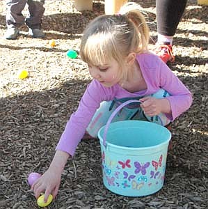 Hundreds of children and their parents attended the annual Sons of the American Legion Easter Egg Hunt at Florence Park in Stewartville on a beautiful spring morning on Saturday, April 20. Here, Easton Boehm of Stewartville reaches to pick up a few eggs during the hunt. Children turned in their eggs for tickets used in a drawing for prizes, which included bicycles, scooters, basketballs, soccer balls, baskets and more.