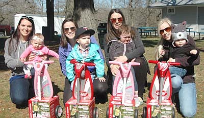 Children 4 years old and younger, held by their mothers, won scooters at the Stewartville Sons of the American Legion Easter Egg Hunt on Saturday morning, April 20. The children include, from left, Harper Grant, Lyle Schneider, Kenzie Kramer and Jack Spangler.