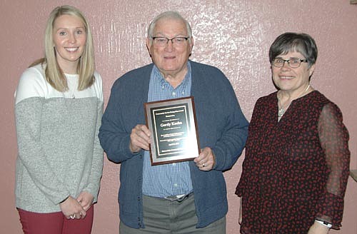 Gordy Koehn, center, has been named the recipient of the Stewartville Community Education Advisory Board's 34th annual Community Service Recognition Award. Hailey Liffrig, community education director, left, presented the award. Glynis Sturm, a member of the Community Education Advisory Board, right, nominated Koehn for the honor. 