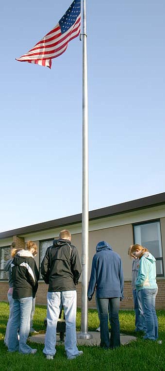A small group of  Stewartville High School students, led by Andrew Langseth, associate pastor at Grace Evangelical Free Church,  gathered around the school's flag pole to pray during the National Day of Prayer on Friday morning, May 1. 