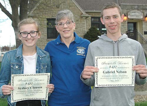 Sydney Clausen, left, and Gabriel Nelson, right, seniors at Stewartville High School, are the recipients of $400 scholarships from the Stewartville Kiwanis Club. Marge Reimers of the Kiwanis Club poses with the students. Laura Pedelty, the third recipient of a Kiwanis Club scholarship, is not pictured.