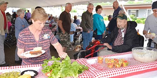 Many family members and friends of residents of the Stewartville Care Center attended a serve-yourself picnic at the Care Center parking lot on Friday afternoon, June 21.