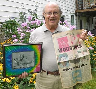 Charlie Brown of Stewartville attended the second day of Woodstock in the Bethel and White Lake, N.Y. area in August 1969. Above, he holds a copy of a 1989 Rochester Post-Bulletin that included Brown in a story marking the 20th anniversary of Woodstock, along with a picture highlighting Brown as the honorary chair of the Stewartville High School "Hippie Homecoming" in 1993. The picture appeared on the front page of the Oct. 5, 1993 issue of the Stewartville STAR.