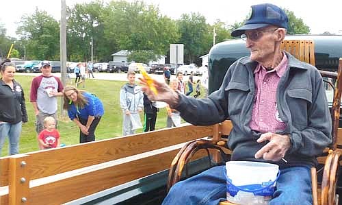Walter "Sonny" Podein, the grand marshal of the 2019 High Forest Old Settlers Day Parade, brought a bucket of candy to share with the children along the parade route on Saturday, Sept. 7.