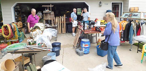The Stewartville STAR's 12th annual Trash &&#8200;Treasure Day garage sales were held Sept. 19-22. Above, Brian and Rene Hinton of Rochester, in the foreground, look for items at a sale hosted by Wes Alrick of Stewartville, in the background at right.