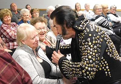 Charlie Lewis of LeRoy, also known as Elvis Presley, sang many hits from the King of Rock and Roll at the Stewartville Civic Center on Sunday, Sept. 29. Above, Elvis sings to a fan face to face as others in the audience look on with delight. Proceeds from the Elvis &&#8200;Son performance will go to the Center 4 Active Adults.