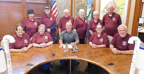 Mayor Jimmie-John King, seated in the center, signed a proclamation last week declaring this Saturday, Oct. 19 White Cane Day in Stewartville. On that day, members of the Stewartville Morning Lions Club will accept donations at the two Kwik Trips, the two Casey's stores and Fareway to fight blindness and other eye diseases. Some of the Morning Lions members who will participate include, front row, from left, Judy Weatherly, Kay Tvedt, chair of White Cane Day; Mayor King; Claudia Belcourt and Pastor David Hoot. Back row, from left, Sharon McAtee, Keith "Mac" McAtee, Lucien Cole, Carol Cole, Karen Freiheit and Clair Mrotek.