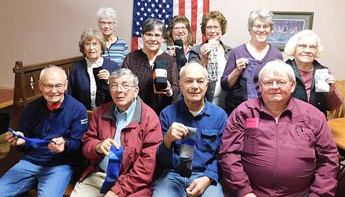 Members of the Stewartville Kiwanis Club encourage local and area residents to donate to the club's third annual Sock It to 'Em sock drive. Members include, front row, from left, Ron Olson, Dr. George Sedgwick, Don Brouillard and Ed Rowley. Back row, from left, Margaret Clark, Diane Bergland, Glynis Sturm, Lori Torgerson, Carol Youdas, organizer of the event; Mary Brouillard and Janice Hagen.