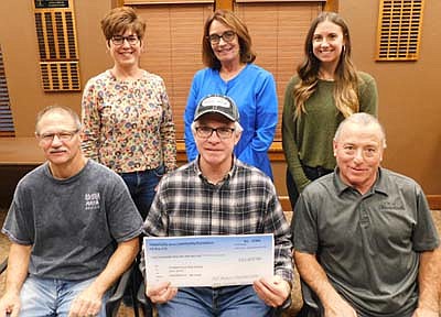 Jeff Beyer, chairperson of the Stewartville Area Community Foundation, displays the $50,000 check the SACF is giving to the Park Board to help pay for the construction of a new amphitheater at Bear Cave Park. Others in the photo include, clockwise from front left, SACF Board members Al Chihak, Lisa Lonien, Patty Geerdes and Emily Fritsch; and Mayor Jimmie-John King, who accepted the check on behalf of the city of Stewartville.