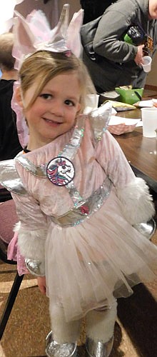 Children and their parents visited the Stewartville American Legion Post 164 in large numbers to enjoy a Halloween party on Thursday, Oct. 31. At lower left, Emma Landherr, 4, of Stewartville, a preschool Tiger Tots student, dresses as a unicorn. "Unicorns are a craze," said Crystal Landherr, Emma's mother. "She loves unicorns."