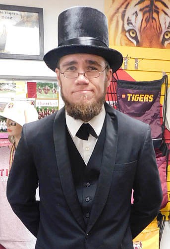 Noah Johnson, a screen printer at C&M Screen Printing & Embroidery in Stewartville, dressed as Abraham Lincoln for Halloween. After growing a beard for winter, he started thinking about a Halloween costume. "I was trying to think of a costume that included a beard, and Abraham Lincoln popped into my head," he said.