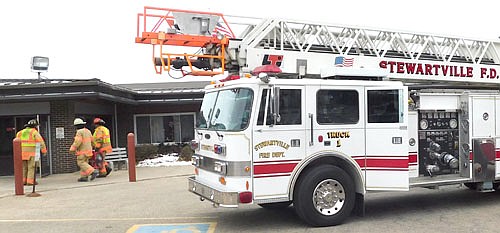 Stewartville's firefighters enter the Stewartville Care Center to ventilate the building after smoke filled its west wing on Wednesday morning, Nov. 13. No firefighters or Care Center residents or staff were injured.