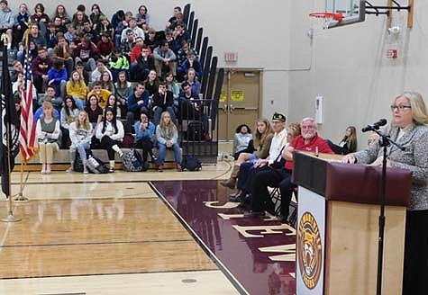 Christy Blade, a U.S. Army veteran and the publisher of the Rochester Post-Bulletin, speaks to a large audience of Stewartville High School-Middle School teachers and students at the annual Veterans Day ceremony at the SHS gym on Monday morning, Nov. 11.