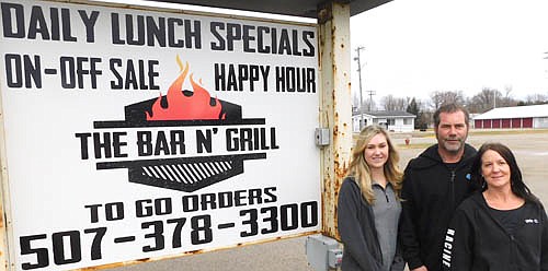Bobby and Angela Carr are the new owners of Carr's Bar N' Grill in Racine. Mike Ward, the previous owner for about two years, sold the business to the Carrs after deciding to move to Arizona to be closer to his family. The Carrs, who took over the business on Monday, Nov. 18, will retain the same staff along with the same menu, which includes sandwiches, wraps, beverages, burgers, salads and lots of appetizers. "Mike ran a heck of a business," Bobby Carr said. "We wouldn't have been able to do this without Mike, the way he set it up for us." Above, Bobby and Angela Carr, center and far right, pose with Katie Houkom, the front manager of the business. The Bar N' Grill, which will offer on-sale and off-sale beer, wine and liquor, will be open Monday through Friday from 11 am. to 9 p.m.; Saturdays from 11 a.m. to 10 p.m. and Sundays from 11 a.m. to 8 p.m. The Spring Valley VFW will sponsor a meat raffle and bingo every Sunday beginning at 2 p.m. Monday will be Burger Night, Tuesday will be Taco and Bingo Night, Wednesday will be Wing Night, Thursday will be Thirsty Thursday, and Sunday will include an All Day Happy Hour. E-tabs and pull tabs will be available. The Bar N' Grill will employ 14 people, including Jesse Sidebottom, the cook-manager. The Carrs are excited about their new business. "The support of all our customers has been overwhelming," Bobby said. "We want to thank all our loyal customers who are sticking with us," Angela said.