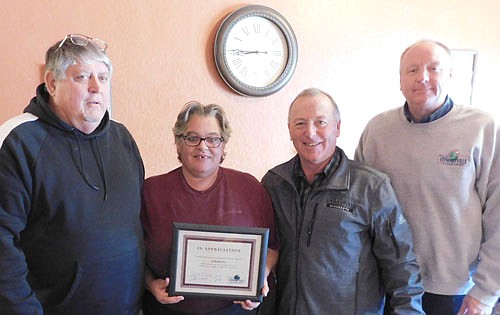 Karrie Heydt, co-owner of Tarsilla's Coffee House and Cafe, second from left, accepts the Economic Development Authority's Business Appreciation Award from Jim Kuisle, EDA&#8200;president, far left; Mayor Jimmie-John King, second from right, and Bill Schimmel Jr., city administrator.