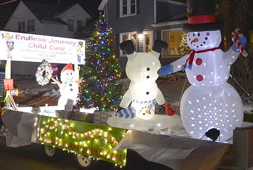 Hundreds of local and area residents attended "Santa's Winterland," part of the Stewartville Area Chamber of Commerce's annual Winterfest celebration, at Florence Park on Saturday evening, Dec. 7. Here the Endless Journey Child Care float featured three snowmen, including one standing on its head.