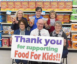 Robert Hruska, grocery manager of Fareway, seated in center, invites the store's shoppers to donate to the 17th annual Food for Kidz at the store from Jan. 27 through Feb. 8. Kiwanis Club members helping with Food for Kidz include, clockwise from lower left, Carol Youdas, Janice Hagen,  Glynis Sturm, Margaret Clark and Mary Brouillard.