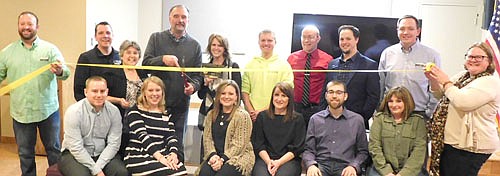 The Stewartville Area Chamber of Commerce, at its annual banquet on Saturday evening, Jan.25, welcomed Marzolf Implement of Spring Valley as a new Chamber member for 2020. Cory Marzolf of Marzolf Implement, fourth from left in the back row, joined by Kammy Fenske, fifth from left, cuts the ribbon to celebrate the occasion. Other Chamber members include, front row, from left, Ryan Mosch, Ashley Mosch, Megan Romens, Alisha Nelson, Kevin Welter and Jennifer Hruska. Back row, from left, Mike Rainey, Josh Buckmeier, Myrna Welter, Keenan Kolstad, Robert Hruska, Ross Zumbach, Nick Johnson and Gwen Ravenhorst.