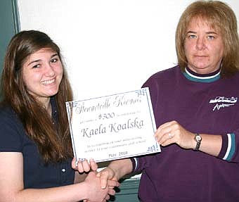 SHE EARNED IT -- Kaela Koalska, a Stewartville High School senior, was introduced as the recipient of a $300 Kiwanis Club scholarship at the annual Stewartville Kiwanis, Builders and Key clubs breakfast at Sammy's Family Restaurant last week.  Rochelle LaFortune, Kiwanis Club member, right, presented the  award. 