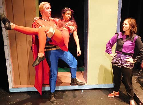 Flash (Dave Stepan) left, rescues Aura (Izzy Maxwell) center, from the dungeon, but his fiance, Dale, misunderstands during a dress rehearsal for the upcoming Stewartville Community Theatre production of Flash Gordon The Musical, to be presented at the Stewartville High School Performing Arts Center on Friday, March 6 and Saturday, March 7 at 7:30 p.m. each evening, and on Sunday, March 8 at 2 p.m. Stewartville Community Theatre is beginning its 25th year, said Aaron Rocklyn, the play's director. "It has been 25 years now, and we've never done science fiction,"&#8200;Rocklyn said. "This is the start of our 25th year. Where does the time go?"
