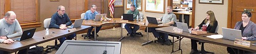 The City Council met at Stewartville City Hall on Tuesday April 14. Mindful of social distancing due to the coronavirus (COVID-19) pandemic, Council members and city staffers sat six feet from each other, including, from left, councilpersons Josh Arndt and Brent Beyer, Mayor Jimmie-John King, councilpersons Craig Anderson and Jeremiah Oeltjen; Karla Strain, finance director, and Cheryl Roeder, city clerk.