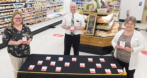 Fareway Stores, Inc. announced last week its plans for distributing $1,000 worth of gift cards to chambers of commerce in communities the store serves in Minnesota, Illinois, Missouri, Nebraska and South Dakota. Robert Hruska, grocery manager of Stewartville's Fareway store, center, displays the 20 Fareway gift cards, worth $50 each, distributed to Gwen Ravenhorst, administrator of the Stewartville Area Chamber of Commerce, left, and Mryna Welter, Chamber membership coordinator, right. The Chamber will give the cards to Chamber-member businesses struggling as a result of the coronavirus (COVID-19) pandemic, Welter said.
