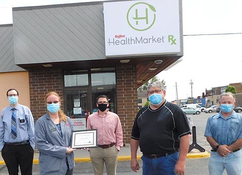 Cara Rentz, certified pharmacy tech at Stewartville's Hy-Vee Health Market Rx, second from left, accepted the Business Appreciation Award from the city of Stewartville's Economic Development Authority last week. Jim Kuisle, EDA president, second from right, and Mayor Jimmie-John King, a member of the EDA, far right, presented the award. In back, from left, are Hy-Vee Health Market Rx employees Wade Hanson, assistant director, and Kyle Rentz, manager of store operations.