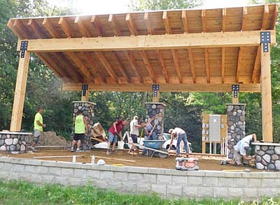 In 90-degree heat, workers from a subcontractor for Radcliffe Homes and Remodeling continued to build the new amphitheater at Bear Cave Park last week. The structure will include a 25-foot by 40-foot stage, a concrete and wood overhead structure and terraced turf seating. Cost estimates for the $149,000 project include $70,000 for the stage, $25,000 for survey, engineering and design fees, and $17,000 for earthwork.