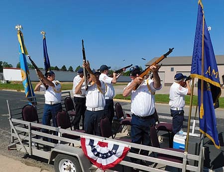 Members of the Stewartville American Legion Post 164 fired into the air to salute America's veterans during the Summerfest mini-parade, which started near the Legion on July 4.