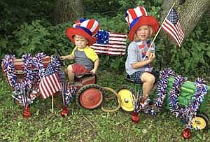 Izabelle Welter, 6, right, and her brother Silas, 19 months, were the first-prize winners in the Stewartville Area Chamber of Commerce's Fourth of July Summerfest Virtual Kids Parade. "We enjoyed doing it, but getting two young ones to sit still was a challenge," said Samantha Welter, the children's mother