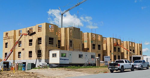 Workers for Schoeppner Construction of Rochester continue to make progress on Flats 55, a new apartment complex near Bear Cave Intermediate School. When it's completed, Flats 55 will offer 55 apartments on four stories, including 41 one-bedroom apartments, priced from about $1,100 to $1,200 each per month, and 14 two-bedroom units, priced at $1,400 to $1,600 per month.