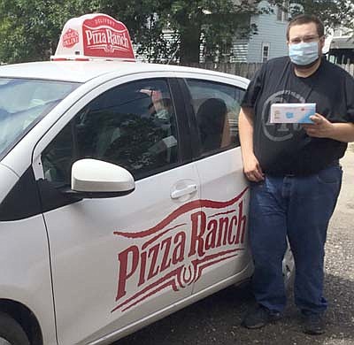 Josh Ihrke of Pizza Ranch stopped by the Stewartville Area Chamber of Commerce's office last week to pick of a free box of masks distributed by the state of Minnesota through local Chamber offices. The Chamber will continue to hand out masks to local businesses at the Chamber office today (Tuesday, Aug. 11)  from 10 a.m.to 1 p.m.