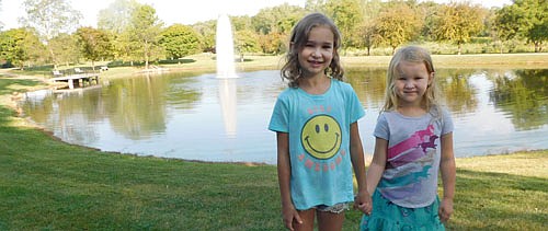 Sophie Welder, 8, and her sister Addy, 5, of Chatfield, visited Stewartville's Florence Park with their mother last week, where they paused to pose for a picture in front of the new fountain on the Florence Park Pond. The new fountain replaces the fountain that was stolen on Thursday, June 11. Karla Strain, finance director, said the city's insurance paid for the new fountain, valued at $9,414.12.