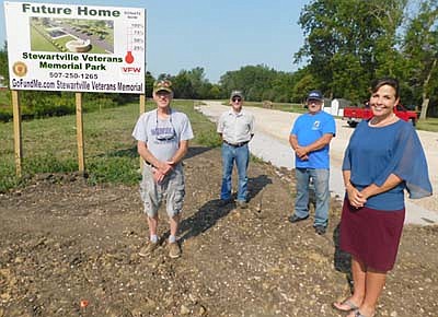 As of last week, representatives of the Stewartville VFW Prescher-Kumm Post 8980 and the Stewartville American Legion Post 164 had raised about $130,000 to help pay for the new $300,000 Veterans Memorial Park to be built near Stewartville's south entrance. Heather Holmes, an employee of Community Economic Development Associates (CEDA), and a former diesel mechanic for the Army National Guard helping the VFW raise funds for the park, standing at right, said the $130,000 includes $80,000 in contributions from individuals, businesses and organizations; $25,000 to $30,000 in in-kind support; and $22,000 to $23,000 thanks to a $50,000 individual donation that will match contributions through the end of 2020. Others helping with the fundraising include, from left, the three Rogers: Roger Winch of the Stewartville VFW, Roger Barsness, quartermaster (treasurer) of the VFW; and Roger Peterson, Legion commander and VFW member.