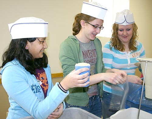 or 16 years, the Stewartville Kiwanis Club has hosted its Food for Kidz food packaging event for the poor at the Stewartville Civic Center. In 2010, from left, Samantha Meyer, Lauren Mikel and Cassy Drees, members of a service  learning class at Stewartville Middle School, help with what was then known as Kids Against Hunger.