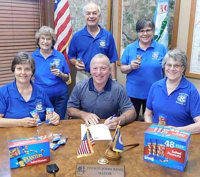 Mayor Jimmie-John King has signed a proclamation declaring the observance of Peanut Days in the city of Stewartville. Kiwanis Club members who will collect donations for the project include, from left, Rita Oswald, Margaret Clark, Don Brouillard, Glynis Strum and Mary Brouillard.