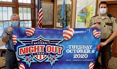 National Night Out, an annual community-building campaign that promotes police-community partnerships and neighborhood camaraderie to make neighborhoods safer, more caring places to live, will be held in Stewartville on Tuesday, Oct. 6. Holding the banner are Mayor Jimmie-John King, left, and Jason Owen, Stewartville's community oriented policing (COPS) deputy. Residents interested in hosting a National Night Out get-together at this year's 37th annual event may register at RochOlmstedNNO.com or call (507) 328-6777.