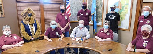 Mayor Jimmie-John King, seated in center, signed a proclamation last week declaring Saturday, Oct. 17 White Cane Day in the city of Stewartville. On that day, members of the Stewartville Morning Lions Club will seek donations at a number of local stores from 8 a.m. to 4 p.m. Contributions will help the Lions restore the gift of sight to those suffering from a variety of eye diseases. Morning Lions participants in White Cane Day include, seated, from left, Kay Tvedt, Sheila Majerus, Mayor King, Cheryl Roeder and Janet Speltz. Standing from left, Sharon Moehnke, tail twister; Ernie Moeller, Noah Johnson, Daniel Rodenwald Jr. and Dave Hoot.
