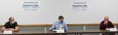 Observing COVID-19 guidelines for wearing masks and keeping their distance from each other, City Council candidates, from left, Brent Beyer, Jeremiah Oeltjen and Dick Uptagrafft take part in a forum at the Stewartville Civic Center on Thursday evening, Oct. 8.
