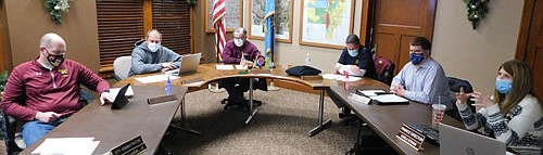 Karla Strain, city finance director, far right, reviews a PowerPoint presentation with the Stewartville City Council at the city's annual truth in taxation meeting at Stewartville City Hall on Tuesday evening, Dec. 8. The city's total budget is $8,604,870 for 2021, a 1.994 percent increase from its 2020 budget, Strain said. "Our budget increase is less than 2 percent, which is less than we even did for last year," she said. City Council members, from left, include Josh Arndt, Brent Beyer, Mayor Jimmie-John King, Craig Anderson and Jeremiah Oeltjen.