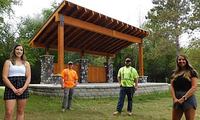 In August, workers had virtually finished the new amphitheater at Bear Cave Park, built to host concerts and other events. City employees who helped build the structure include, in back, from left, Jason Welter and Jake Burzinski. In front, from left, are Regan Lonien and Emily Fritsch, members of the Stewartville Area Community Foundation, which financed the project.