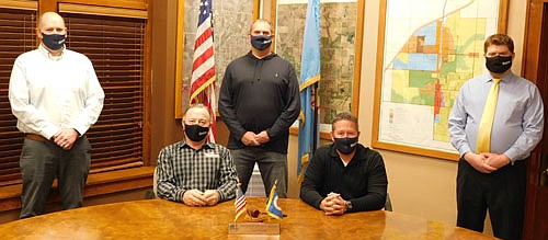 The Stewartville City Council hosted its annual reorganizational meeting at City Hall last Tuesday evening, Jan. 12. Masked up and observing COVID-19 social distancing guidelines are, seated, from left, Mayor Jimmie-John King and Councilperson Craig Anderson. Standing, from left, are councilpersons Josh Arndt, Brent Beyer and Jeremiah Oeltjen. At last week's meeting, the Council approved King's appointments and designations for the coming year. At the Council's last meeting this past December, King bid adieu to 2020. "It's been quite a year, like we've never seen,"&#8200;he said. "I think we're going to have a much better 2021."