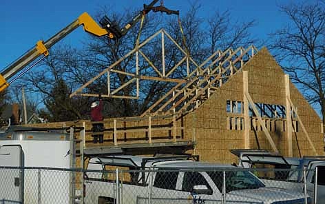 Workers from Kreofsky Building Systems of Plainview continue to make progress on the construction of the new Cabin Coffee building, scheduled to open along Stewartville's Main Street this June. Last week, Kreofsky employees raised and placed trusses to support the building's roof. Kevin and Robin Splittstoesser, longtime Stewartville residents, purchased the parking lot just north of First Alliance Credit Union as the coffee shop's future home.
